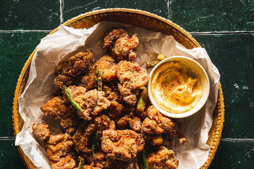 This image released by Voracious shows a recipe for sesame cumin chicken, from the cookbook "The Chinese Way" by Betty Liu. (Betty Liu/Voracious via AP)