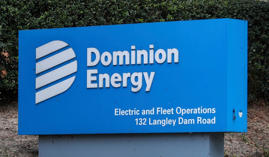 FILE - The Dominion Energy sign outside of the Electric and Fleet Operations center in the aftermath of Hurricane Helene on Sept. 29, 2024, in Aiken, S.C. (AP Photo/Artie Walker Jr., File)