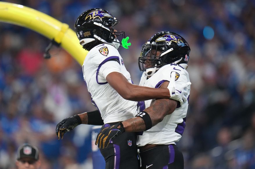 Baltimore Ravens' Derrick Henry celebrates his touchdown run with Ja'kobi Lane during the first half of an NFL football game against the Indianapolis Colts Sunday, Sept. 13, 2026, in Indianapolis. (AP Photo/Jeff Roberson)