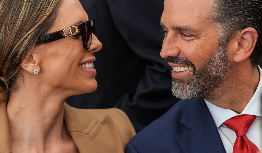 Donald Trump Jr. and his wife Bettina Anderson look at each other while waiting for President Donald Trump to speak at Deerfield Residence, the residence of the U.S. Ambassador to Ireland Edward S. Walsh, Saturday, Sept. 12, 2026, in Dublin. (AP Photo/Julia Demaree Nikhinson)