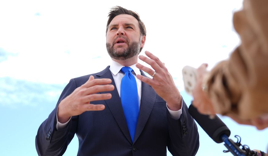Vice President JD Vance talks to reporters before he boards Air Force Two, Monday, Sept. 14, 2026, at Joint Base Andrews, Md. (AP Photo/Mark Schiefelbein, Pool)