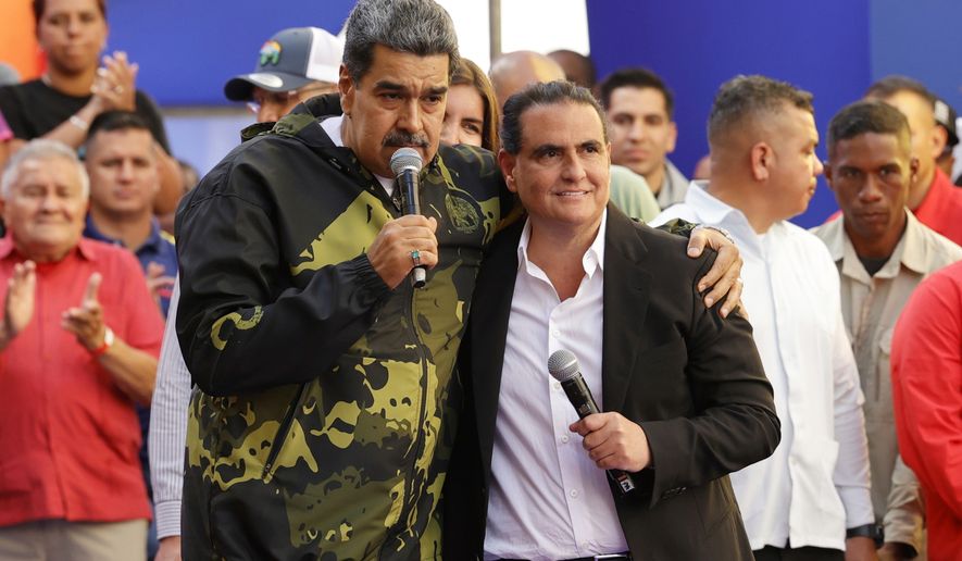 FILE - Venezuela's President Nicolas Maduro, left, and Alex Saab stand together during an event marking the anniversary of the 1958 coup that overthrew dictator Marcos Perez Jimenez, in Caracas, Venezuela, Jan. 23, 2024. (AP Photo/Jesus Vargas, File)