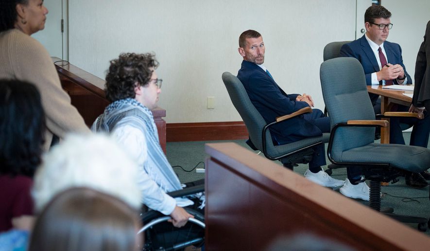 Jason Eaton watches as Hisham Awartani arrives to testify in Eaton's trial in Burlington, Vt., Monday, Sept. 14, 2026. (Glenn Russell/Pool photo via AP)