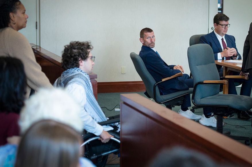 Jason Eaton watches as Hisham Awartani arrives to testify in Eaton's trial in Burlington, Vt., Monday, Sept. 14, 2026. (Glenn Russell/Pool photo via AP)
