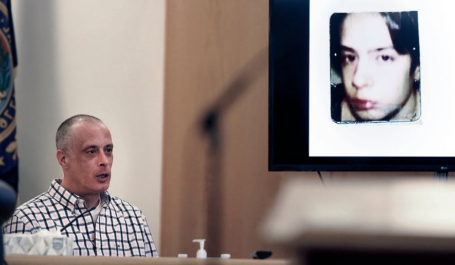 Youth Development Center plaintiff David Meehan testifies as his intake photo, when he was 14 is displayed during his civil trial at Rockingham County Superior Court in Brentwood, N.H. on April 17, 2024. (David Lane/Union Leader via AP, Pool, file)
