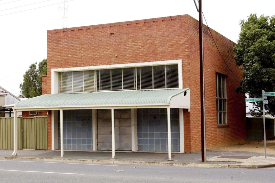 The former bank building where dismembered bodies were stored in barrels is photographed in Snowtown, Australia, on Oct. 22, 2002. (Rob Hutchison/AAP Image via AP)