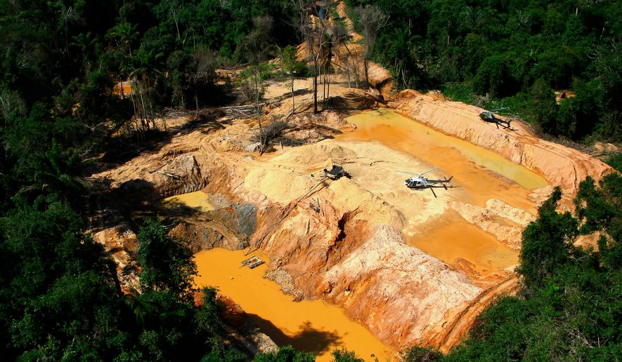 FILE - An illegal mining camp is visible from a Brazil Environmental Agency helicopter during an operation to try to contain illegal mining in Yanomami Indigenous territory, Roraima state, Brazil, Feb. 11, 2023. (AP Photo/Edmar Barros, File)