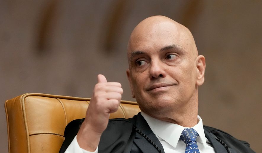 Supreme Court Justice Alexandre de Moraes gives a thumbs-up during a plenary session of the court in Brasilia, Brazil, Wednesday, Sept. 2, 2026. (AP Photo/Eraldo Peres)