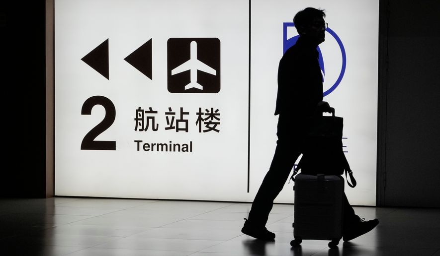 A passenger arrives at the Capital Airport in Beijing on Nov. 7, 2025. (AP Photo/Ng Han Guan, File)