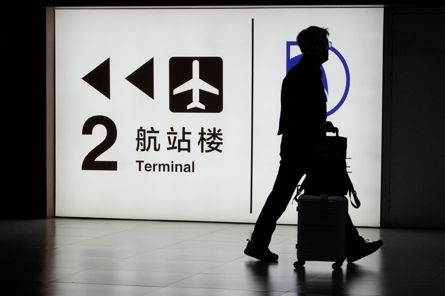 A passenger arrives at the Capital Airport in Beijing on Nov. 7, 2025. (AP Photo/Ng Han Guan, File)