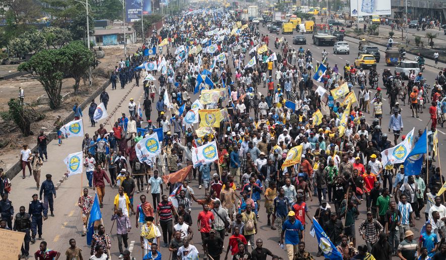 People march during a protest organized by opposition parties against constitutional changes proposed by President Felix Tshisekedi, in Kinshasa, Congo, Tuesday, Sept. 15, 2026. (AP Photo/Samy Ntumba Shambuyi)