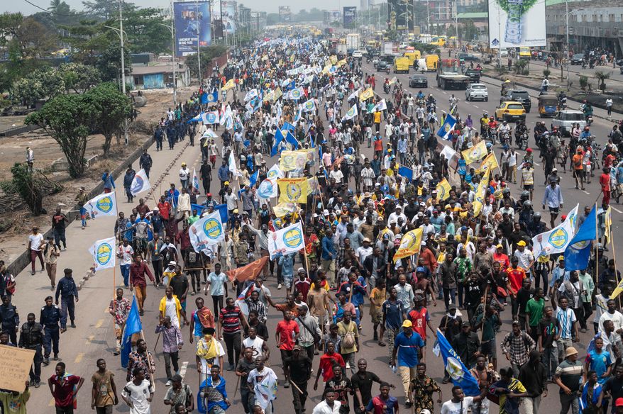 People march during a protest organized by opposition parties against constitutional changes proposed by President Felix Tshisekedi, in Kinshasa, Congo, Tuesday, Sept. 15, 2026. (AP Photo/Samy Ntumba Shambuyi)