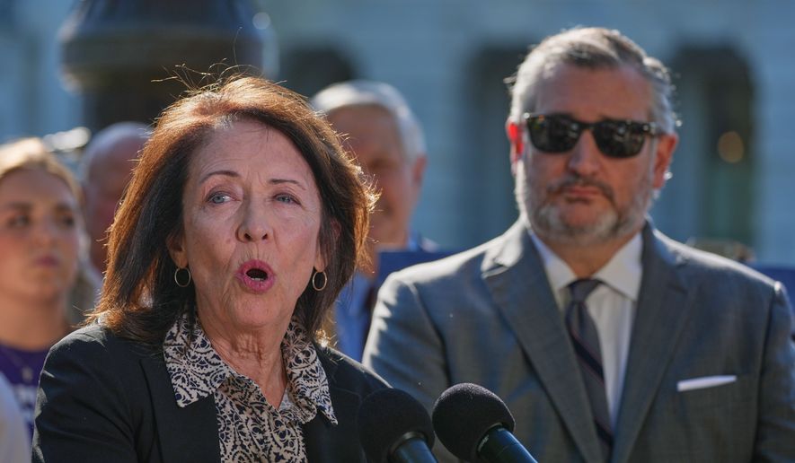 Sen. Maria Cantwell, D-Wash., left, speaks as Sen. Ted Cruz, R-Texas, right, listens during a news conference on Capitol Hill, Monday, Sept. 14, 2026, in Washington. (AP Photo/Mariam Zuhaib)