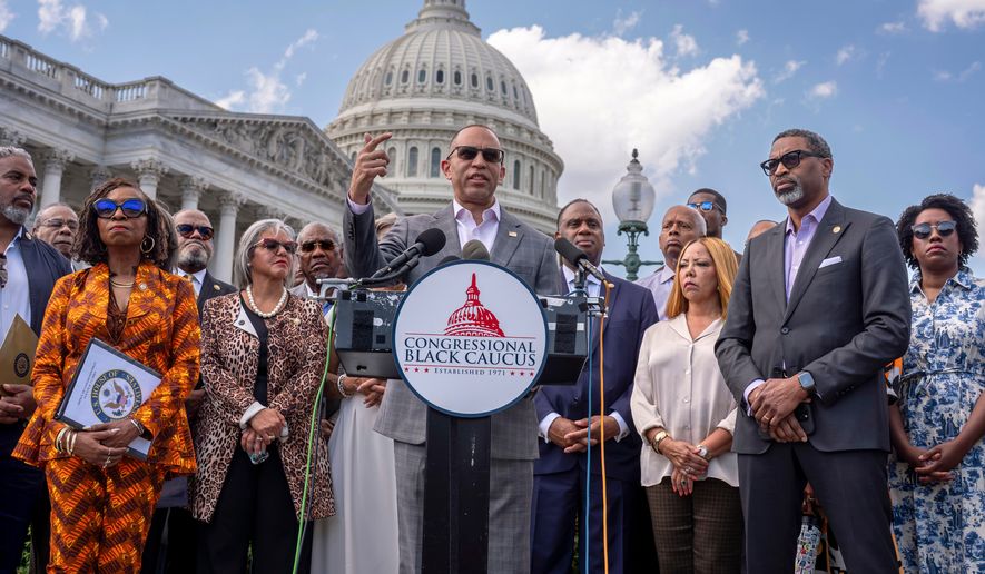 FILE - House Minority Leader Hakeem Jeffries, D-N.Y., center, and members of the Congressional Black Caucus speak outside the Capitol in Washington, May 19, 2026. (AP Photo/J. Scott Applewhite, File)