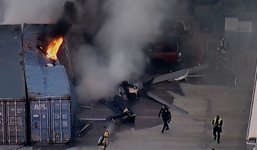In this still image provided by KABC-TV shows first responders work the scene after a helicopter crashed near a bus crash in Chatsworth, a neighborhood in Los Angeles, Tuesday, Sept. 15, 2026. (KABC-TV via AP)