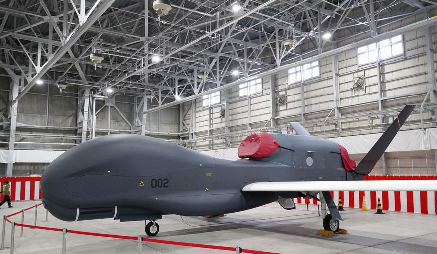 A Global Hawk, long-distance surveillance drone of the Japan Air Self-Defense Force, is shown to the media at its base in Misawa, Aomori prefecture, on Jan., 2023. (Kyodo News via AP)