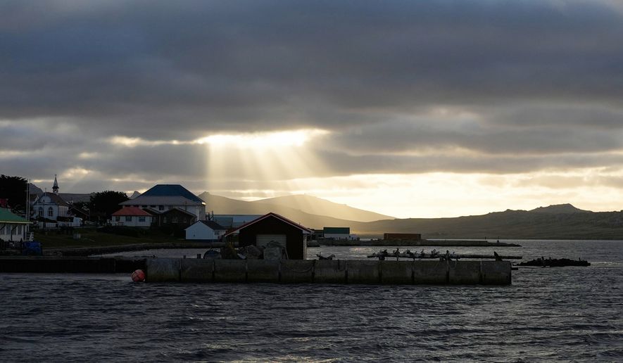 Sunlight breaks through the clouds over Stanley on the Falkland Islands, also known as Islas Malvinas, March 14, 2026. (AP Photo/Ricardo Mazalan, File)