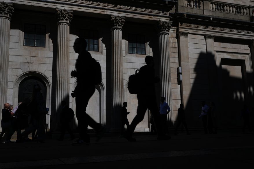 Pedestrians walk past the Bank of England in London, April 30, 2026. (AP Photo/Kirsty Wigglesworth) **FILE**