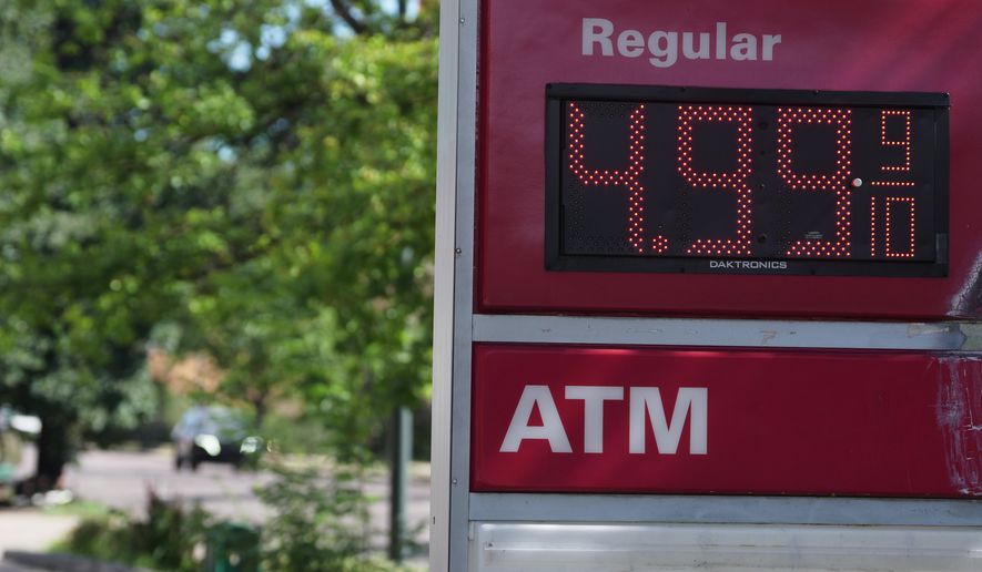 The per-gallon price for regular unleaded fuel is displayed electronically on a sign outside a Conoco gasoline station Wednesday, Sept. 9, 2026, in Denver. (AP Photo/David Zalubowski)