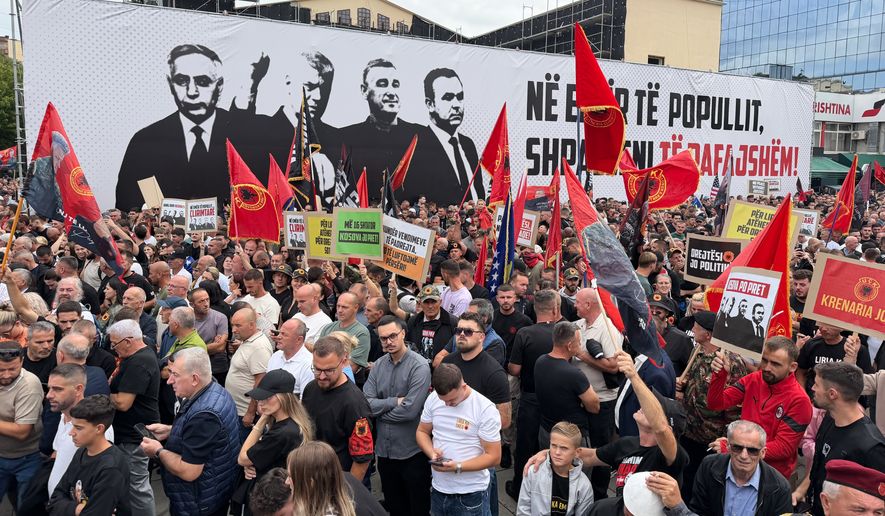 People rally in Pristina, Kosovo, Saturday, Sept. 12, 2026, in support of the former president Hashim Thaci and the other defendants, Kadri Veseli, Rexhep Selimi and Jakup Krasniqi ahead of their verdicts next week at a Netherlands-based court which tried them for alleged war crimes during a 1998-1999 separatist war from Serbia. (AP Photo/Zana Cimili)