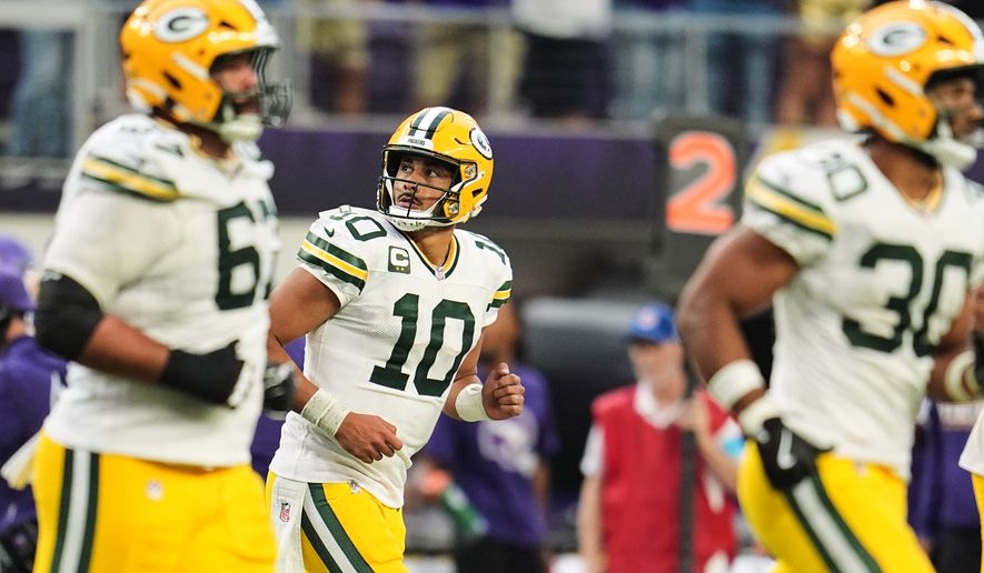 Green Bay Packers quarterback Jordan Love (10) and the offense jog off the field after Love threw an interception during the second half of an NFL football game against the Minnesota Vikings, Sunday, Sept. 13, 2026, in Minneapolis, Minn. (AP Photo/Abbie Parr)