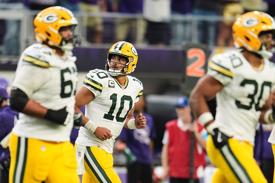 Green Bay Packers quarterback Jordan Love (10) and the offense jog off the field after Love threw an interception during the second half of an NFL football game against the Minnesota Vikings, Sunday, Sept. 13, 2026, in Minneapolis, Minn. (AP Photo/Abbie Parr)
