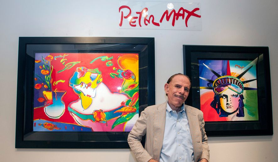 Artist Peter Max poses for a photo during his retrospective with the Road Show Company exhibit, Sept. 6, 2014, in Northbrook Court mall in Northbrook, Ill. (Photo by Barry Brecheisen/Invision/AP, File)