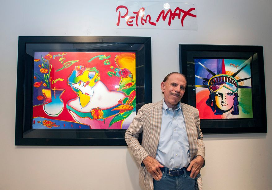 Artist Peter Max poses for a photo during his retrospective with the Road Show Company exhibit, Sept. 6, 2014, in Northbrook Court mall in Northbrook, Ill. (Photo by Barry Brecheisen/Invision/AP, File)