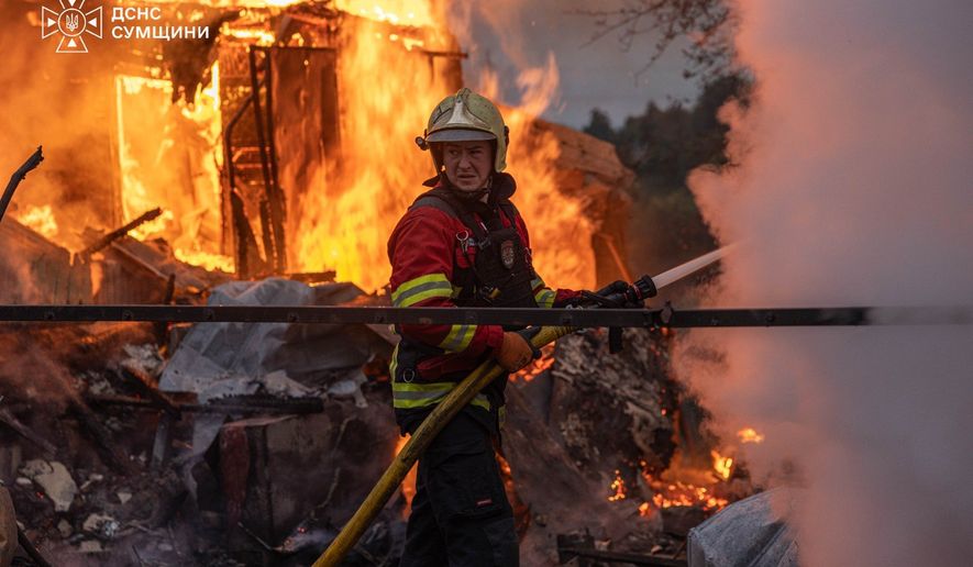 In this photo provided by the Ukrainian Emergency Service, firefighters put out a fire at private homes following a Russian air attack in Sumy, Ukraine, Wednesday, Sept. 16, 2026. (Ukrainian Emergency Service via AP)