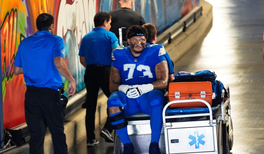 Detroit Lions guard Christian Mahogany (73) is carted into the tunnel after being injured in the first half of an NFL football game against the New Orleans Saints, Sunday, Sept. 13, 2026, in Detroit. (AP Photo/Paul Sancya)