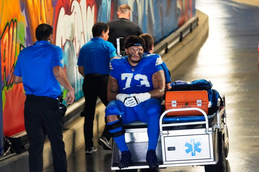 Detroit Lions guard Christian Mahogany (73) is carted into the tunnel after being injured in the first half of an NFL football game against the New Orleans Saints, Sunday, Sept. 13, 2026, in Detroit. (AP Photo/Paul Sancya)