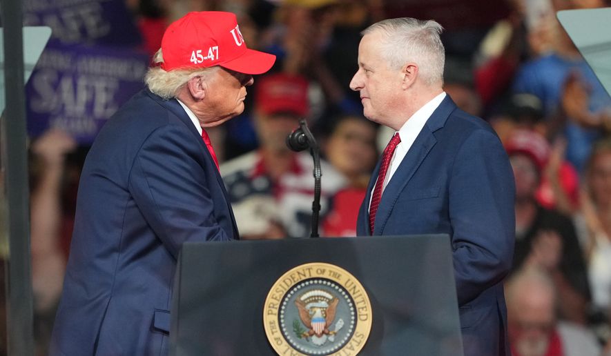 Michael Whatley, North Carolina senatorial get each other during a campaign rally at the Gastonia Municipal Airport, Wednesday, Sept. 16, 2026, in Gastonia, N.C. (AP Photo/Matt Kelley)