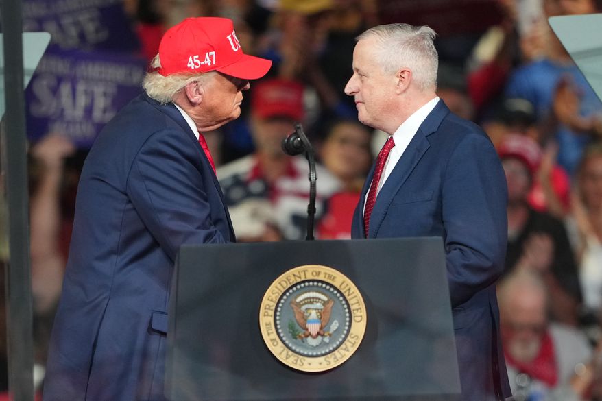 Michael Whatley, North Carolina senatorial get each other during a campaign rally at the Gastonia Municipal Airport, Wednesday, Sept. 16, 2026, in Gastonia, N.C. (AP Photo/Matt Kelley)