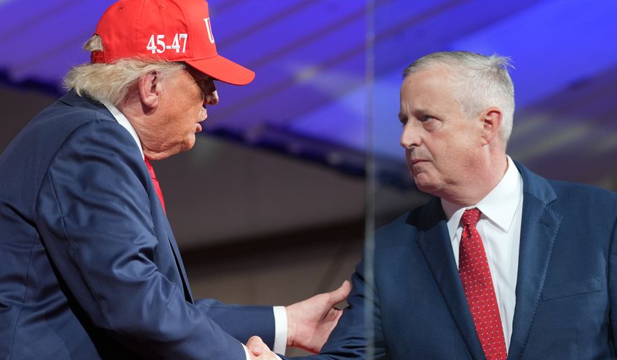 President Donald Trump greets North Carolina Republican U.S. Senate candidate Michael Whatley during a rally at Gastonia Municipal Airport, Wednesday, Sept. 16, 2026, in Gastonia, N.C. (AP Photo/Alex Brandon)