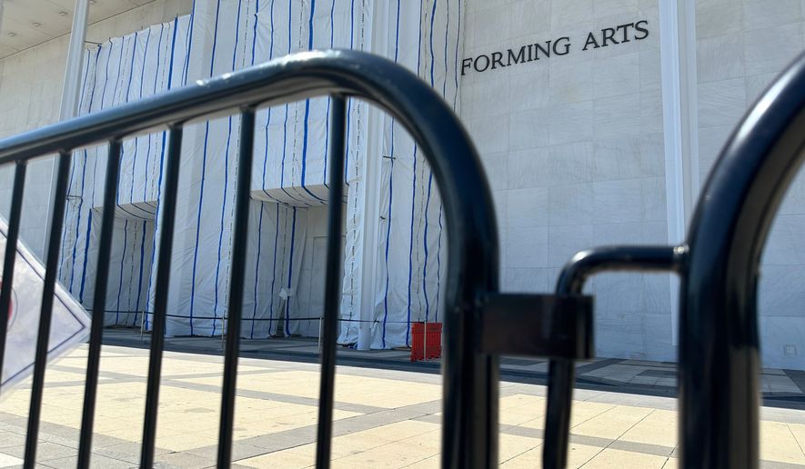 Barriers are placed outside the John F. Kennedy Center for the Performing Arts on Wednesday, Sept. 16, 2026, in Washington. (AP Photo/Nathan Ellgren)