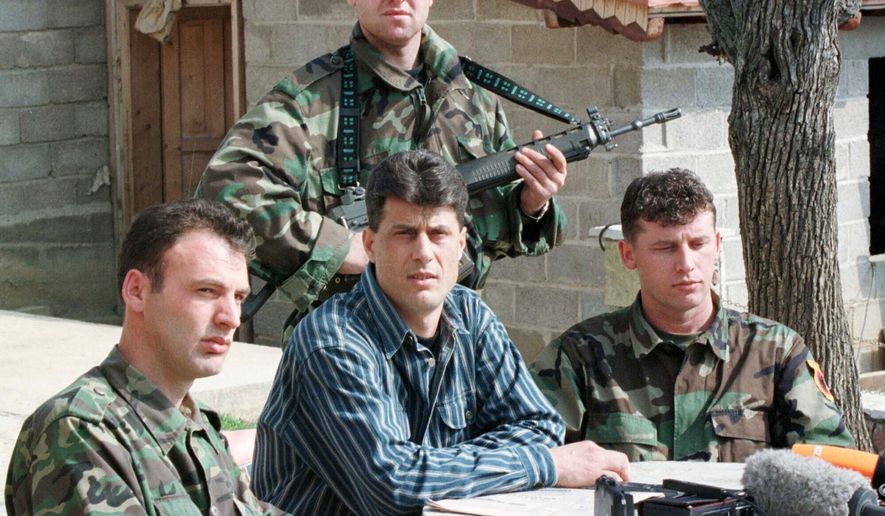 FILE - Hashim Thaci, head of the Kosovo Albanian negotiation team and head of the Kosovo Liberation Army political directorate, center, addresses a press conference in a secret location in central Kosovo, Saturday, March 13, 1999. (AP Photo/Visar Kryeziu, File)