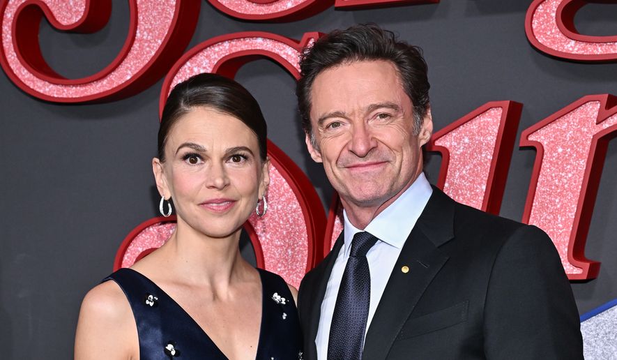 Sutton Foster, left, and Hugh Jackman attend the premiere of "Song Sung Blue" at AMC Lincoln Square on Thursday, Dec. 11, 2025, in New York. (Photo by Evan Agostini/Invision/AP)