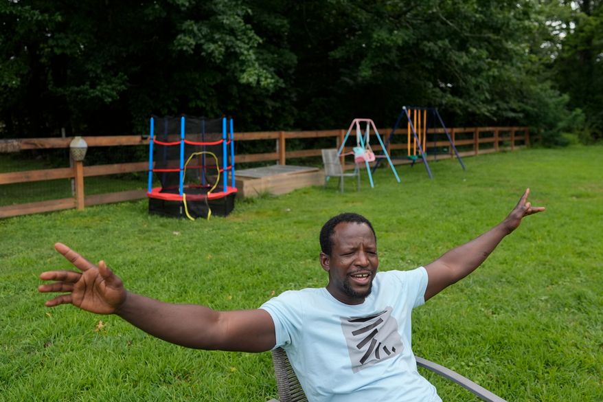 Khalidou Sy, a Mauritanian immigrant, talks in the backyard of his family's home in Lockland, Ohio, Friday, July 31, 2026. (AP Photo/Carolyn Kaster)