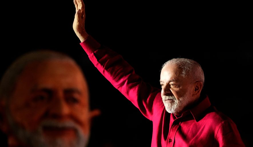 Brazilian President Luiz Inacio Lula da Silva, who is running for reelection, waves to supporters during a campaign rally in the Ceilandia neighborhood of Brasilia, Brazil, Wednesday, Sept. 16, 2026. (AP Photo/Eraldo Peres)