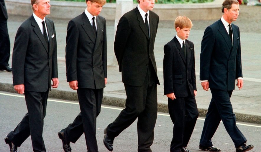 FILE - From left: Britain's Prince Philip, Prince William, Earl Spencer, Prince Harry and Prince Charles walk outside Westminster Abbey during the funeral procession for Diana, Princess of Wales, Sept. 6, 1997. (AP Photo/Jeff J. Mitchell, Pool, File)