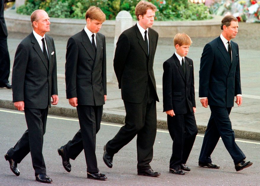 FILE - From left: Britain's Prince Philip, Prince William, Earl Spencer, Prince Harry and Prince Charles walk outside Westminster Abbey during the funeral procession for Diana, Princess of Wales, Sept. 6, 1997. (AP Photo/Jeff J. Mitchell, Pool, File)