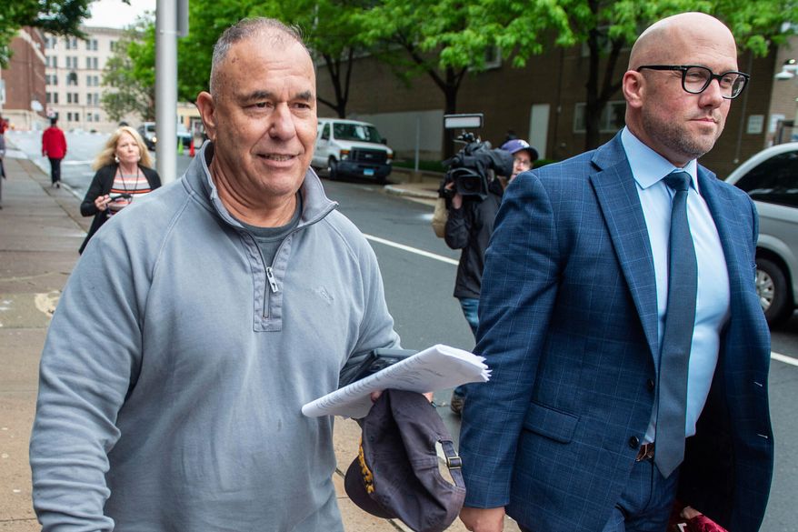 Former Connecticut deputy budget director Konstantinos "Kosta" Diamantis, left, accompanied by his lawyer Vincent Provenzano, right, walks out of federal court on May 16, 2024, in Hartford, Conn. (Aaron Flaum/Hartford Courant via AP, File)