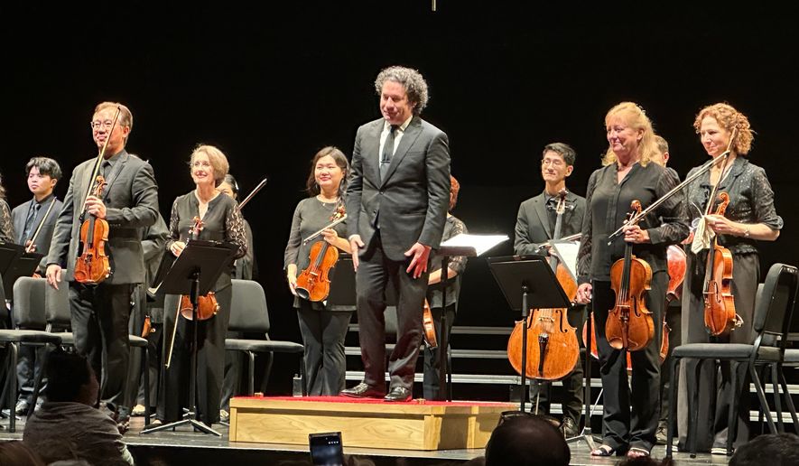 Gustavo Dudamel appears with the New York Philharmonic at a Sounds of Remembrance concert to commemorate the 25th anniversary of the 9/11 attacks at the Perelman Performing Arts Center in New York on Sept. 11, 2026. (AP Photo/Ron Blum)