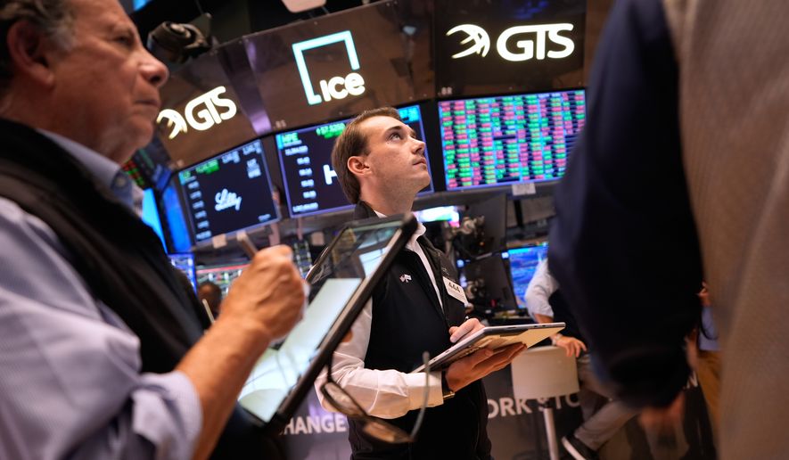Traders work on the floor at the New York Stock Exchange in New York, Wednesday, Sept. 16, 2026. (AP Photo/Seth Wenig)