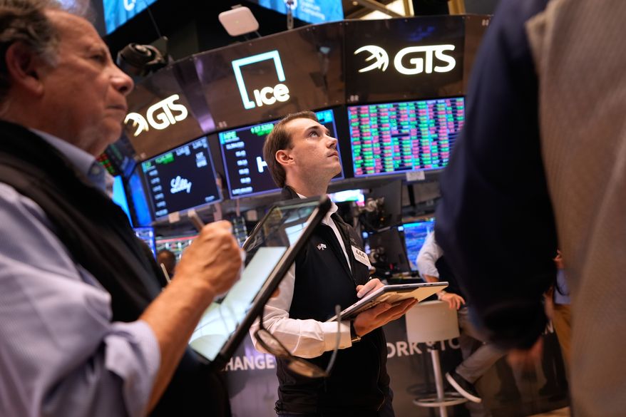 Traders work on the floor at the New York Stock Exchange in New York, Wednesday, Sept. 16, 2026. (AP Photo/Seth Wenig)