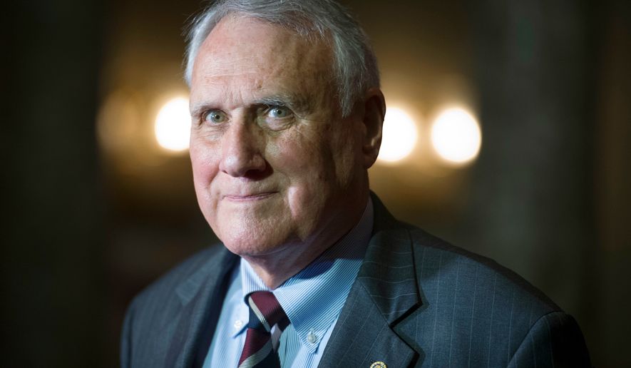 FILE - Sen. Jon Kyl, R-Ariz., waits to be sworn-in by Vice President Mike Pence during his ceremonial swearing-in at the Old Senate Chamber on Capitol Hill, in Washington, Sept. 5, 2018. (AP Photo/Cliff Owen, File)