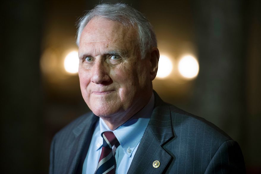 FILE - Sen. Jon Kyl, R-Ariz., waits to be sworn-in by Vice President Mike Pence during his ceremonial swearing-in at the Old Senate Chamber on Capitol Hill, in Washington, Sept. 5, 2018. (AP Photo/Cliff Owen, File)