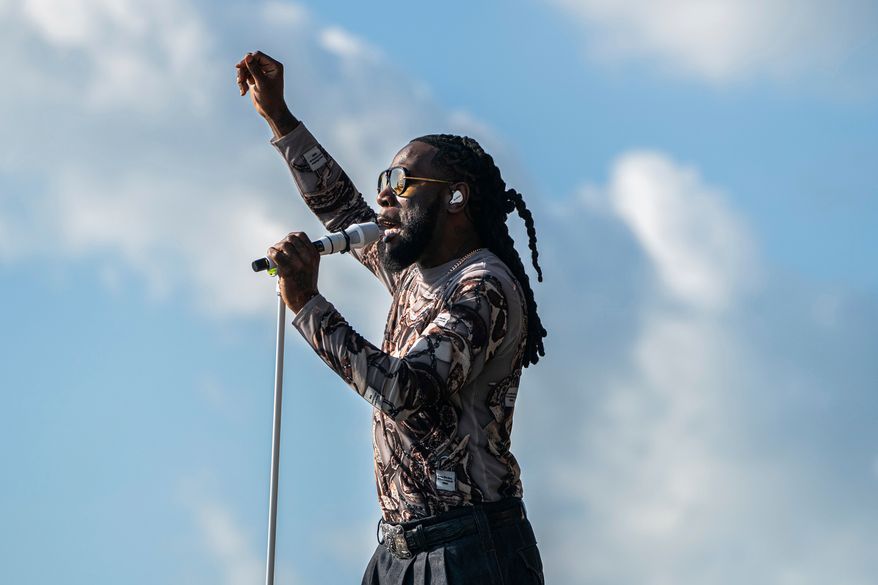 FILE - Burna Boy performs during the first weekend of the New Orleans Jazz & Heritage Festival on April 27, 2025, at Fair Grounds Race Course in New Orleans. (Photo by Amy Harris/Invision/AP, File)