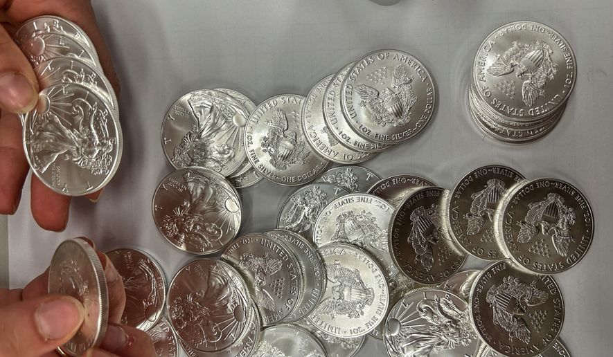 This handout photo released by Norwegian economic crime investigators on Thursday, Sept. 17, 2026, shows the U.S. "American Eagle" silver coins discovered by police in a van that was stopped after being driven "erratically" outside Oslo in April 2025. (Norwegian economic crime investigators via AP)
