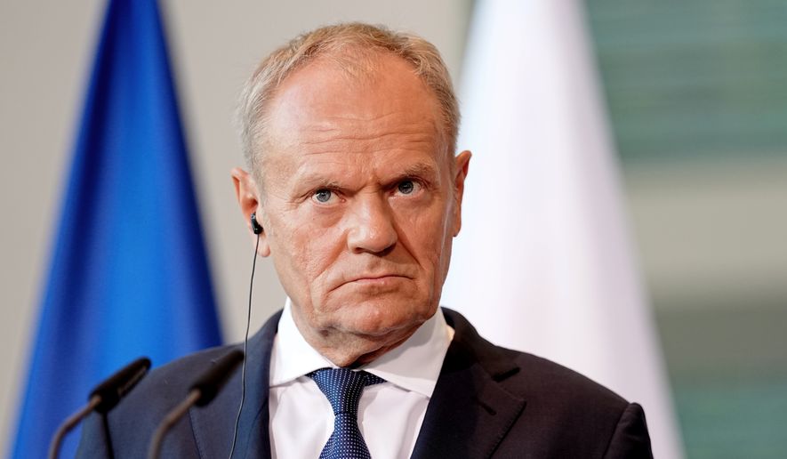 Polish Prime Minister Donald Tusk looks on during a press conference during the E5 summit of leading European nations ahead of the upcoming NATO summit, in Berlin, Wednesday June 24, 2026. (Kay Nietfeld/dpa via AP, File)